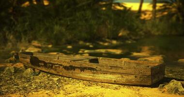 CGI Wooden boat resting on the shore of a tranquil river during sunset video