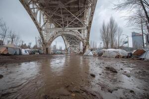 A homeless encampment under an overpass in portland, oregon photo