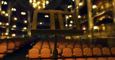CGI Empty theater with a music stand in focus and elegant seating video