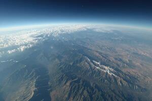 An aerial view of the mountains and clouds photo