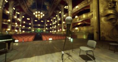 CGI Empty theater stage with microphone and chairs before a performance event video