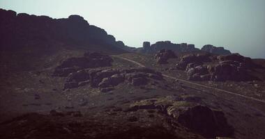 CGI Rocky mountain landscape with winding path amidst rugged terrain video