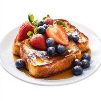 A plate of golden-brown French toast dusted with powdered sugar and topped with fresh strawberries, blueberries, and a drizzle of maple syrup. The thick slices of bread have a perfect custardy texture. Isolated on clean white background photo