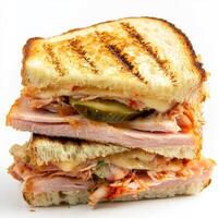 A close-up of a Cuban sandwich, enriched with the tangy and spicy flavors of Korean kimchi, featuring roasted pork, ham, Swiss cheese, pickles, and kimchi mayo, served on grilled Cuban bread, a unique and flavorful twist on a popular sandwich, isolated on photo
