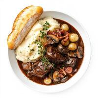 A decadent and rich beef Bourguignon, beef braised in red wine with mushrooms, pearl onions, and bacon, served with creamy mashed potatoes and a side of crusty baguette, a hearty and comforting dish, garnished with fresh thyme and parsley, isolated on cle photo