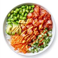 A colorful poke bowl with diced raw salmon, avocado, edamame, shredded carrots, and sushi rice, drizzled with a creamy sriracha mayo sauce. The ingredients are neatly arranged for a vibrant presentation. Isolated on clean white background photo