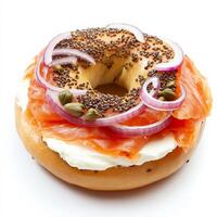 A traditional bagel with smoked salmon, cream cheese, capers, and red onion slices. The bagel is slightly toasted, adding a crunch to this classic breakfast sandwich. Isolated on clean white background photo