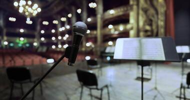 CGI Empty theater stage prepares for upcoming performance with microphone ready video
