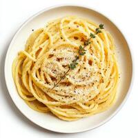 A vibrant plate of tonnarelli cacio e pepe, featuring long, square-cut spaghetti tossed with pecorino romano cheese, black pepper, and a touch of pasta water to create a creamy sauce, a simple yet flavorful Roman pasta dish, garnished with a sprig of fres photo