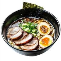 A steaming bowl of ramen with thin wheat noodles, tender slices of chashu pork, a soft-boiled egg, and a rich, umami-packed tonkotsu broth. The dish is garnished with scallions, nori, and sesame seeds. Isolated on clean white background photo