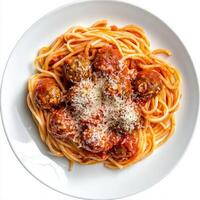 A plate of spaghetti alla chitarra, featuring square-shaped spaghetti made on a guitar-like tool, tossed with a simple tomato sauce and meatballs, a classic Abruzzese dish, garnished with grated pecorino romano cheese, isolated on clean white background. photo