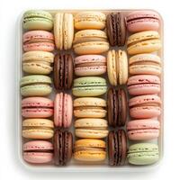 A tray of assorted French macarons in pastel colors, featuring flavors like raspberry, pistachio, vanilla, and chocolate, neatly arranged for an elegant presentation. Isolated on clean white background photo
