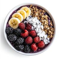 A vibrant bowl of acai topped with granola, sliced bananas, fresh berries, shredded coconut, and a drizzle of honey. A nutrient-packed, refreshing superfood breakfast. Isolated on clean white background photo