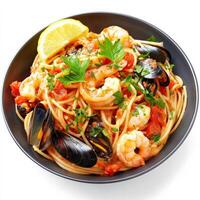 A vibrant bowl of seafood pasta, featuring spaghetti or linguine tossed with a variety of fresh seafood, such as shrimp, mussels, clams, and calamari, in a light tomato or white wine sauce, garnished with fresh parsley and a lemon wedge, isolated on clean photo
