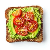 A fresh avocado toast on whole-grain bread, topped with mashed avocado, cherry tomato slices, a sprinkle of sesame seeds, and a drizzle of olive oil. The creamy texture contrasts with the crisp bread, making it a perfect healthy snack. Isolated on clean w photo