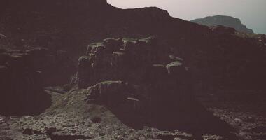CGI Rocky landscape with rugged cliffs and mountains during overcast weather video