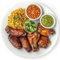 A plate of chicken wings, transformed with the bold and smoky flavors of Mexican barbecue, served with a side of refried beans, Mexican rice, and a variety of salsas, a unique and flavorful take on a classic American appetizer, showcasing the fusion of ba photo
