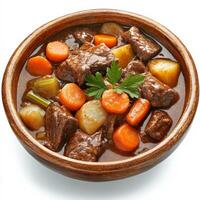 A hearty beef stew with chunks of tender slow-cooked beef, carrots, potatoes, and celery, simmered in a rich, savory broth. Served in a rustic bowl, perfect for cold-weather comfort food. Isolated on clean white background photo