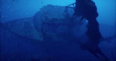 CGI Exploring the remains of a sunken ship in deep ocean waters video
