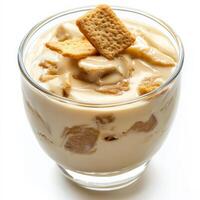 A dessert in a glass with crackers on top photo