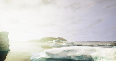 CGI Icebergs float serenely in a calm arctic bay under soft sunlight video