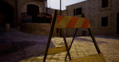 CGI Caution sign on a cobblestone street in an old town during twilight hours video