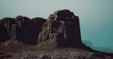 CGI Majestic rock formations rise under a serene sky in a remote landscape video