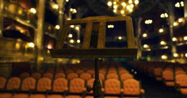 CGI Empty theater with a music stand in the foreground during a performance break video