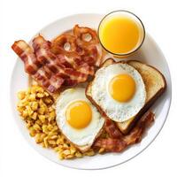 Breakfast plate with eggs, bacon, and corn on white background photo