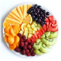 A plate of fruit arranged in a circle photo