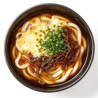 A bowl of noodles with a slice of cheese and green onions photo