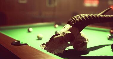 CGI Unique billiard table setup featuring a skull and pool balls in rustic venue video