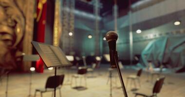 CGI Empty stage prepares for musical performance in vibrant theatre setting video