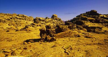CGI Desert landscape showcasing unique rock formations in a clear blue sky video