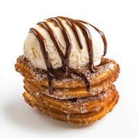 A stack of cinnamon rolls with ice cream and chocolate sauce photo