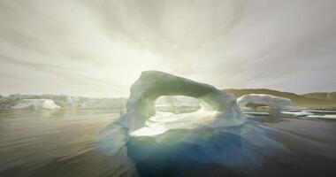 CGI Majestic ice arch illuminated by sunlight in tranquil Arctic waters video