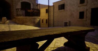 CGI Old wooden bench in a quiet historic courtyard during twilight video