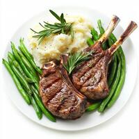 Grilled lamb chops with mashed potatoes and green beans photo