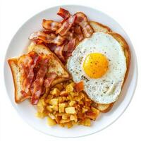 Fried egg, bacon, and toast on a plate photo