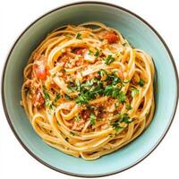Spaghetti with tomato sauce in a bowl on a white background photo