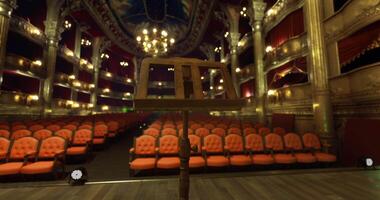 CGI Ornate theater interior with empty seating and music stand in focus video