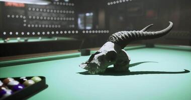 CGI Unique skull decor on a pool table challenges traditional gaming setting video