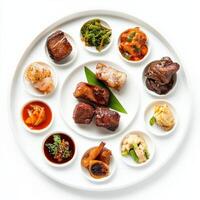 A plate with various types of meat and vegetables photo