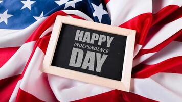 Celebrating Independence Day with a festive message on a backdrop of the American flag photo