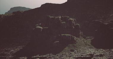 CGI Rugged rock formations under a cloudy sky in a remote landscape video