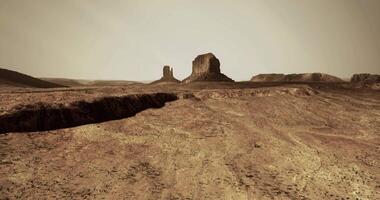 CGI Desert landscape with rock formations under hazy sky at dusk video