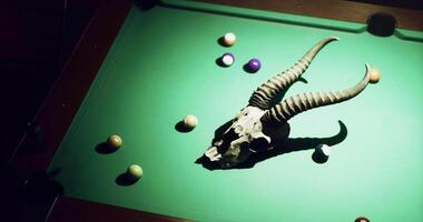 CGI Unique pool table setup featuring a skull with horns and colorful balls video