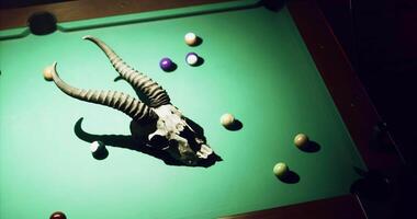 CGI Art installation on a pool table with a ram skull and colorful balls video