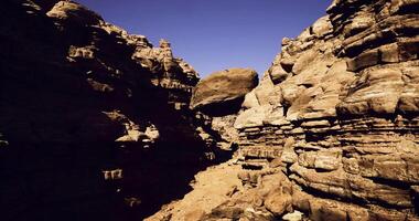 CGI Exploring a rugged canyon with towering rock formations and unique boulders video