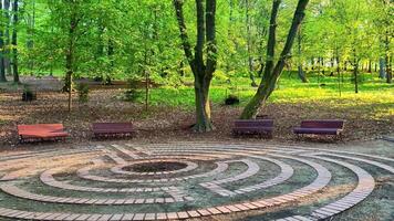 A circular maze in the middle of a park photo